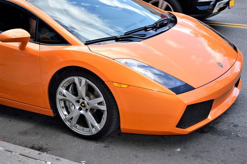 land vehicle, outdoors, low rider, innovation, engine, motorshow, sportscar, v12, luxury, curb, reflection, asphalt, hood, steel, city, parking, day, fast