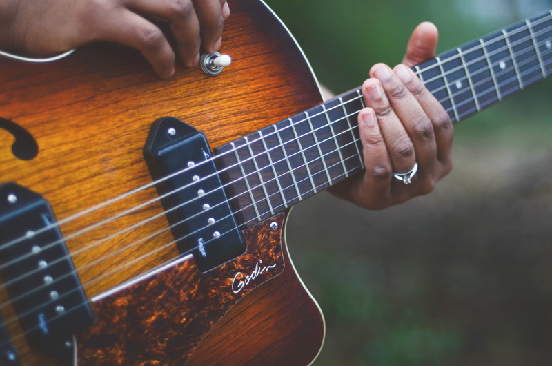 arts culture and entertainment, african, electric guitar, fretboard, musician, instrument, guitar, guitar player, one person, performing, entertainment