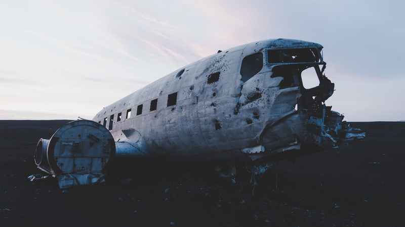 mode of transportation, deterioration, white, daytime, abandoned, airplane, commercial Airplane, land, plane wreck, black, floor, obsolete, cloud - sky