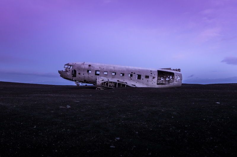 airplane, history, outdoors, run-down, the past, air vehicle, sea, damaged, no People, open field, mode of transportation, crash, field, transportation