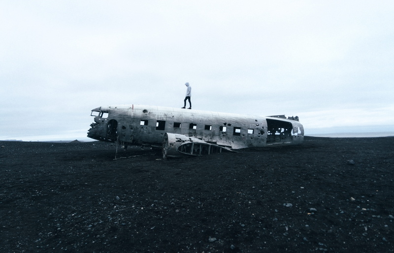 wreckage, junk, water, old, real people, ocean, transportation, built structure, sky, debris, standing, abandoned, mode of transportation, day, outdoors