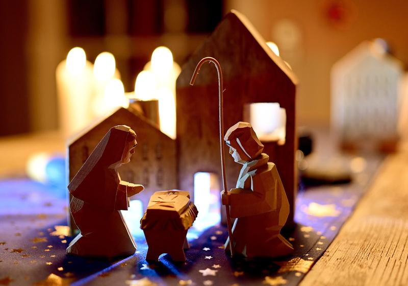 art and craft, night, candle, figurine, burning, close-up, still life, candles, container, human representation, indoors, no people, craft, religion, holy family
