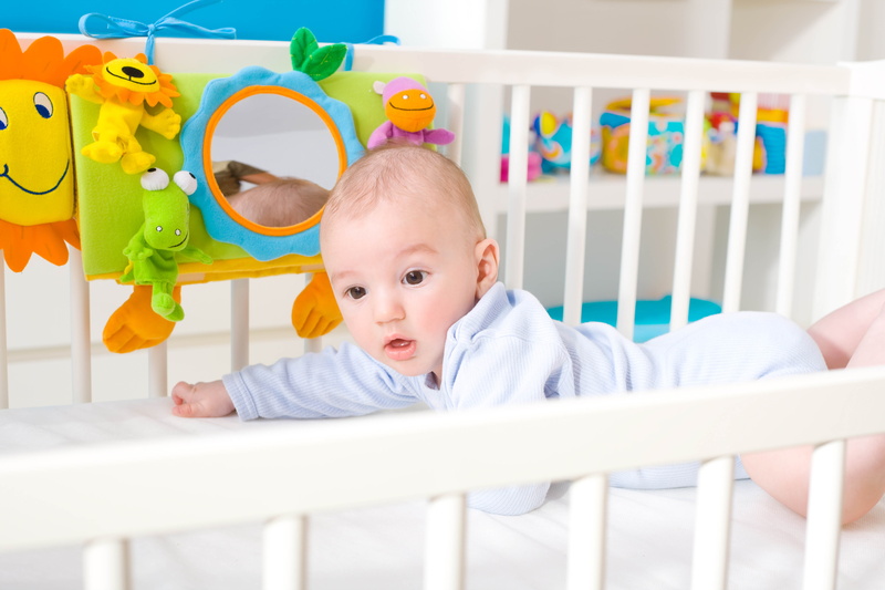 young, crib, nursery - Bedroom, baby clothing, new Life, people, white, boys, wooden, joy, newborn, multi Colored, cute, human Face, playful, front view