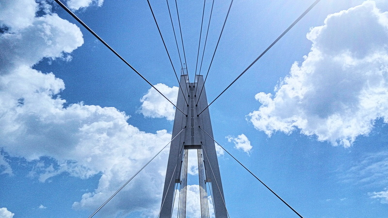 tall - high, nature, built structure, architecture, transportation, low angle view, clouds, directly below, power line, connection, day, power supply, metal
