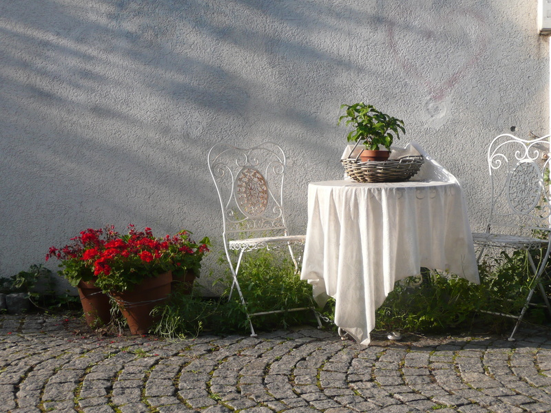 set, white color, near, table, red, green color, art and craft, sculpture, flowers, seat, outside, potted plant, no people, decoration, patio, flower, statue