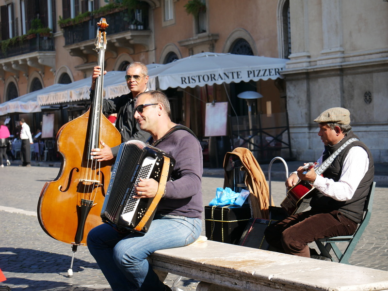 architecture, string instrument, men, artist, outdoors, street musician, built structure, street performer, musical instrument, busker, arts culture and entertainment
