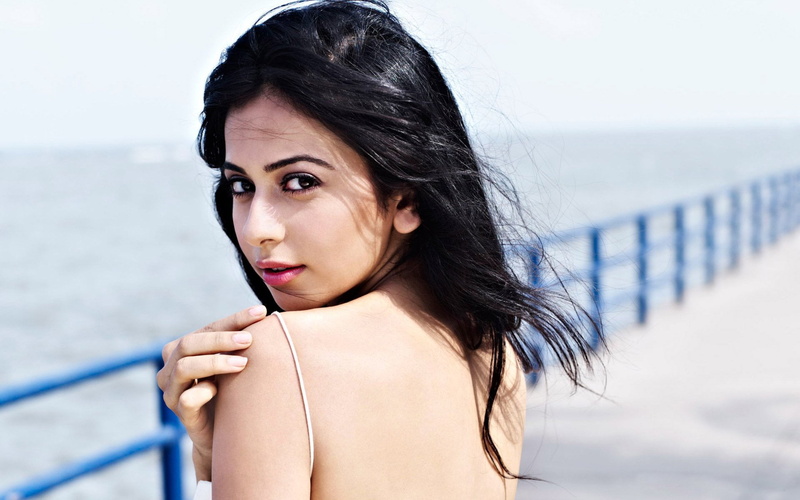 leisure activity, black hair, looking over shoulder, contemplation, Rakul Preet Singh, hairstyle, portrait, young women, focus on foreground, one person