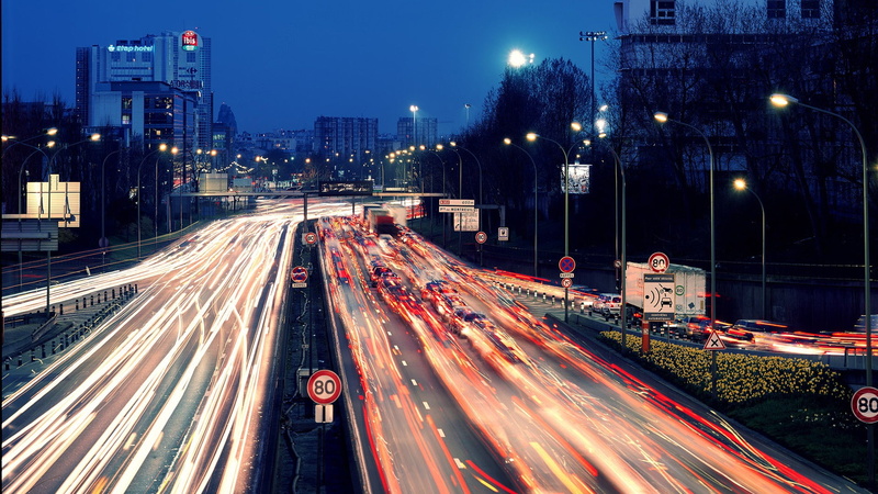 multiple lane highway, illuminated, light trail, city street, transportation, building exterior, no people, motion, long exposure, modern, architecture