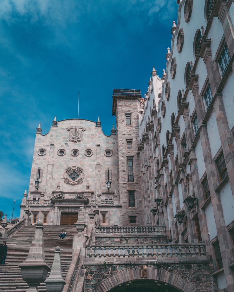travel destinations, spire, railing, religion, neighborhood, outdoors, office building, metropolis, buildings, guanajuato, no people, brown, the past, day