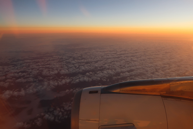 beauty in nature, mid-air, aerial view, motion, outdoors, orange color, no people, sky, scenics - nature, air vehicle, airplane, jet engine, travel, environment