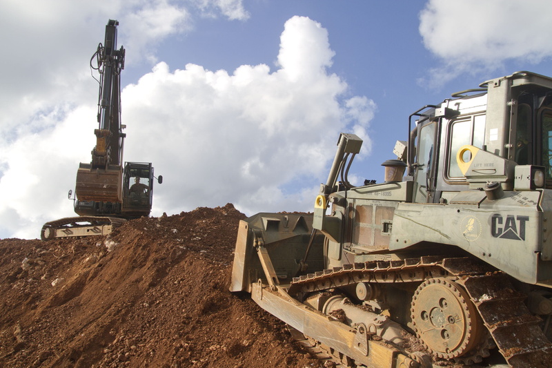 construction site, outside, construction machinery, outdoors, land vehicle, construction industry, steel, earth mover, heavy, cloud - sky, machines, mode of transportation