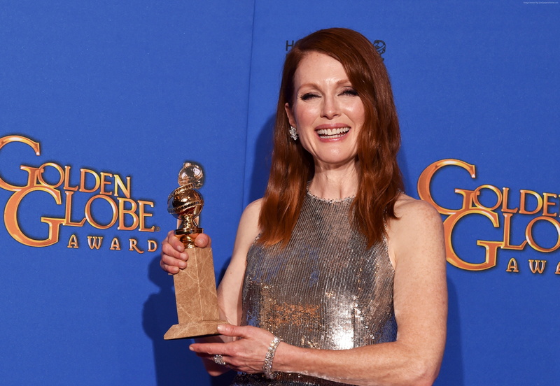 hairstyle, Most Popular Celebs in 2015, childrens author, colored background, waist up, emotion, holding, lifestyles, studio shot, indoors, Still Alice