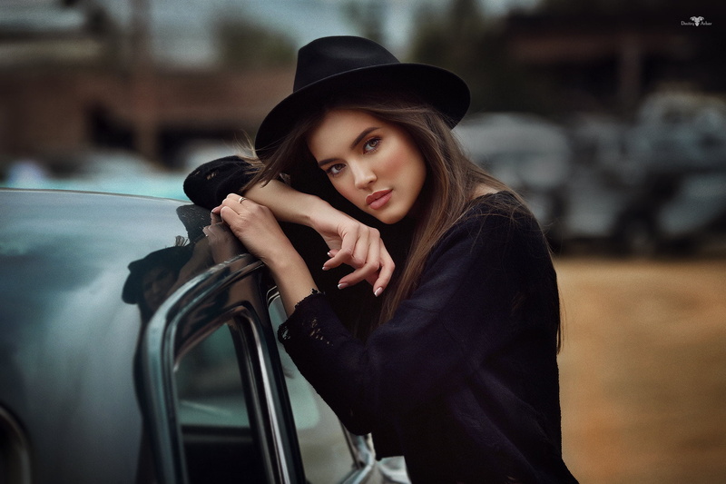women, casual clothing, millinery, contemplation, clothing, beautiful woman, black hat, young adult, leisure activity, women with cars, focus on foreground