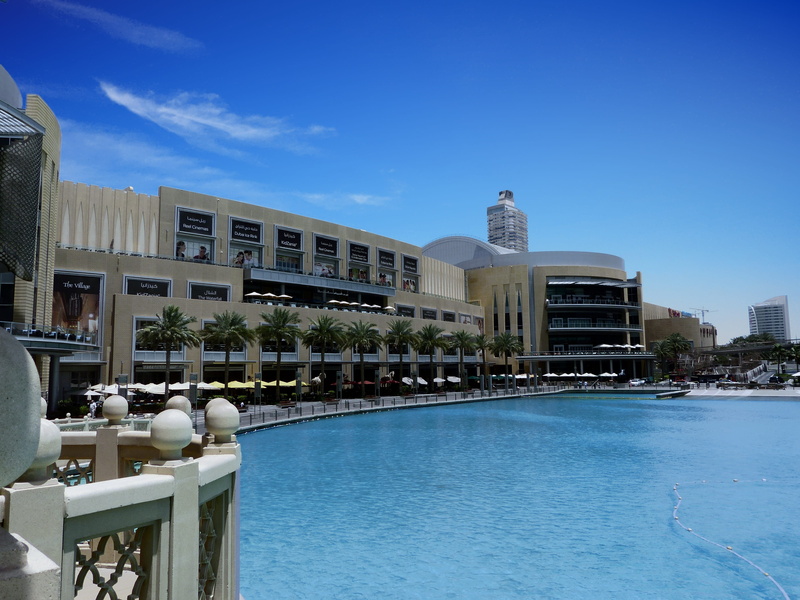 no people, clear sky, travel destinations, water, built structure, blue, city, swimming pool, luxury, nature, dubai, sunlight, waterfront, pool, outdoors