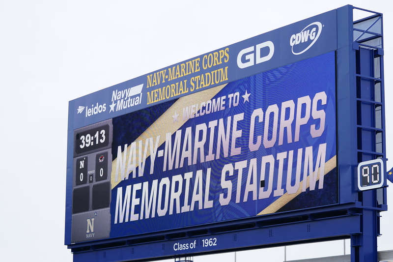stadium, clothing, western script, credit card, id cards, arrival departure board, billboard, architecture, jaw, scoreboard, guidance, memorial, communication