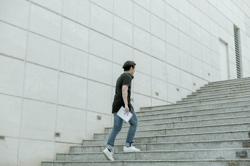 outdoors, adult, built structure, stairs, wall, motion, gray, upstairs, young men, concrete, architecture, 5K, building exterior, one person, walking