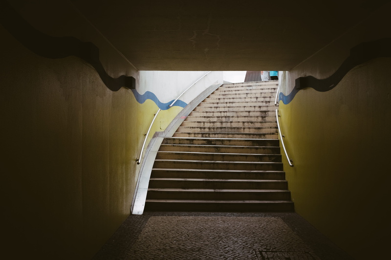 empty, staircase, light at the end of the tunnel, stair, wavy, architecture, tunnel, low angle view, building, stairs, subway, underpass, ceiling, absence