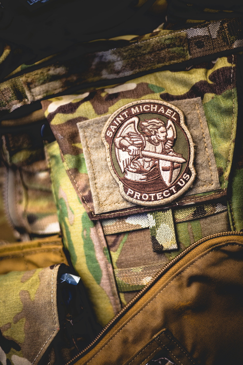 chest, military, communication, patch, pattern, green color, medal, design, selective focus, day, camouflage, focus on foreground, 5K, close-up, us military