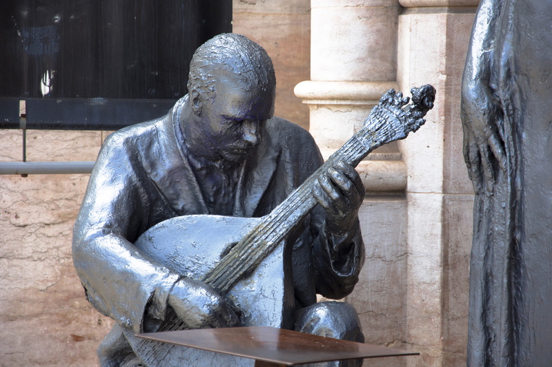 apparel, day, art, wood, plant, clothing, sculpture, history, banjo, close-up, carving - craft product, performer, drum, human representation, the past