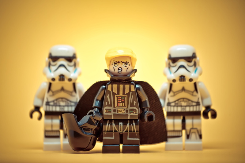political, close-up, figurine, 5K, costume, table, stormtrooper, colored background, childhood, concept, storm trooper, small, robot, male likeness, states