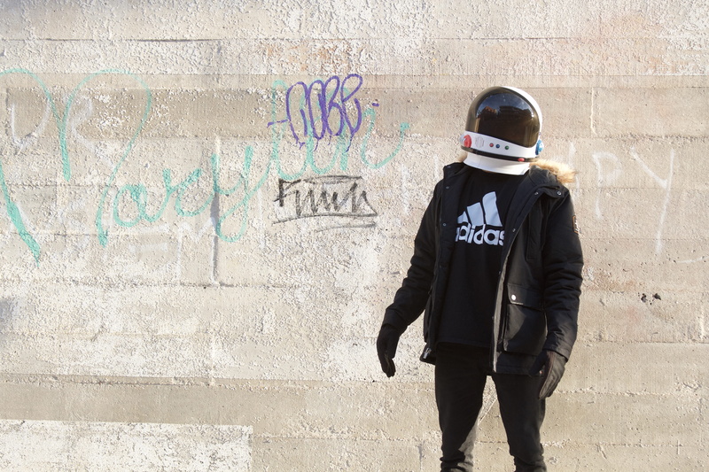 helmet, western script, text, built structure, real people, dope, wall - building feature, city, fall, lifestyle, astronaut, style, 5K, uniform, graffiti