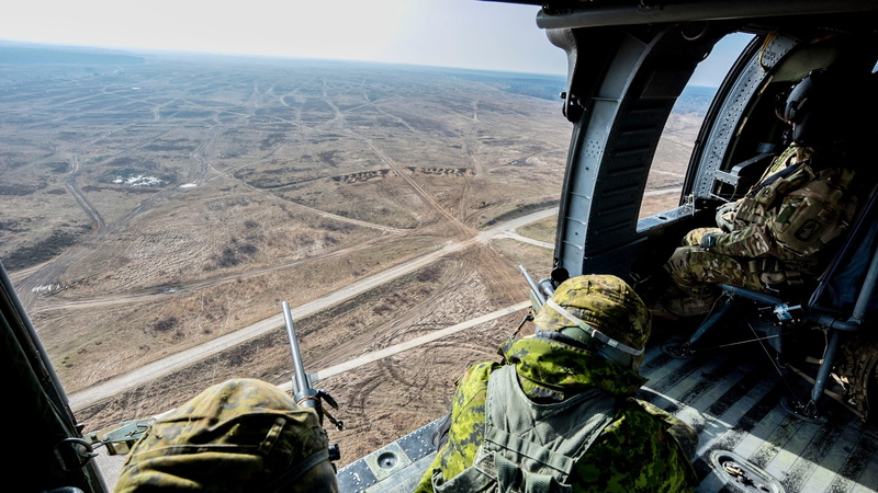 outdoors, helicopters, transportation, scenics - nature, land, 2K, land vehicle, tire, flying, one person, nature, military, Poland, non-urban scene, Canadian Army