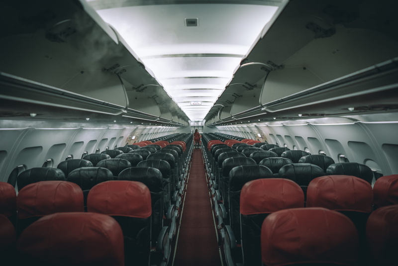 large group of objects, subway train, empty airplane, walking, in a row, ceiling, airplane interior, airplane aisle, public transportation, car, architecture