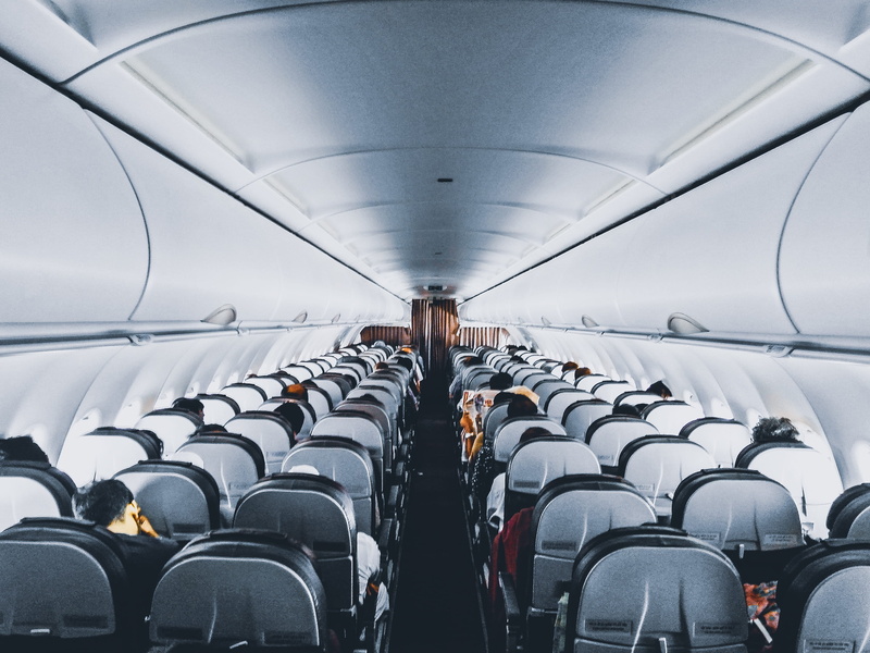 in a row, rows of seats, journey, airplane seat, row, sitting, group of people, transportation, flight, modern, mode of transportation, aviation, technology
