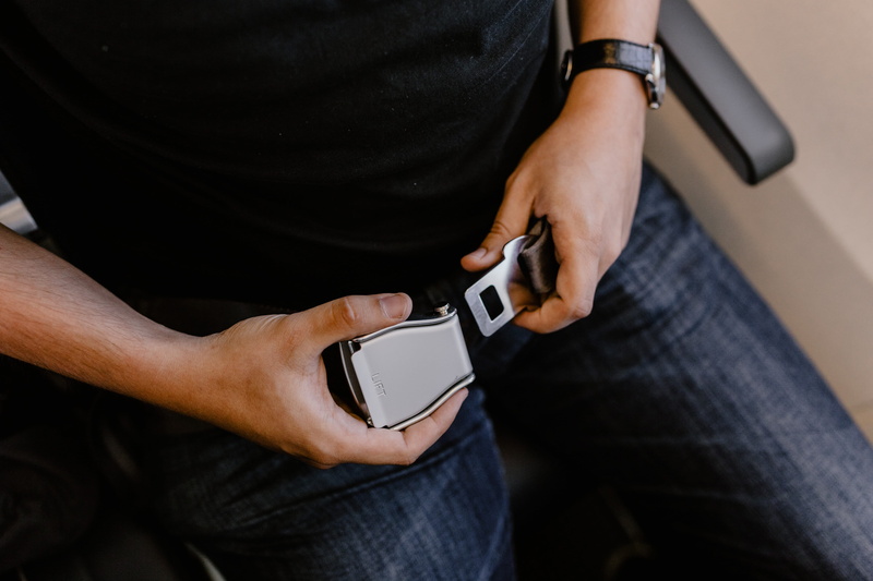 connection, airplane, portable information device, holding, midsection, men, travel, communication, wearable computer, mobile phone, hand, passenger, human body part
