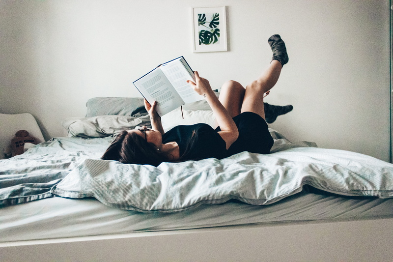room, casual clothing, flooring, domestic room, lying, studying, woman, heel, plant, lifestyles, bedroom, lying down, activity, one person, publication