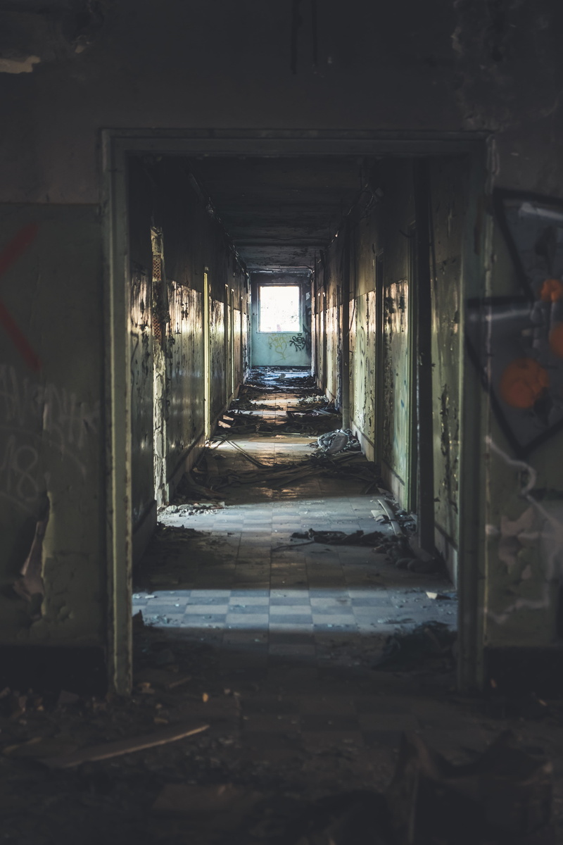 hallway, corridor, no people, prison, furniture, crypt, city, road, built structure, ruined, obsolete, damaged, old, day, tunnel, arcade game machine, indoors