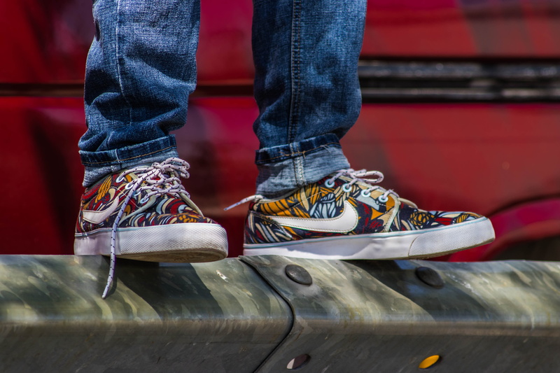 pair, real people, shoes, daylight, blue jeans, metal rail, rubber shoes, casual clothing, human limb, person, jeans, leisure activity, lifestyles, 5K