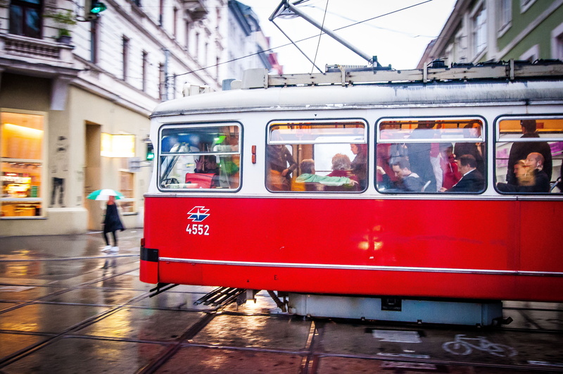 track, mode of transportation, tram, land vehicle, cable car, street, railroad track, real people, austria, group of people, men, architecture, rain, train