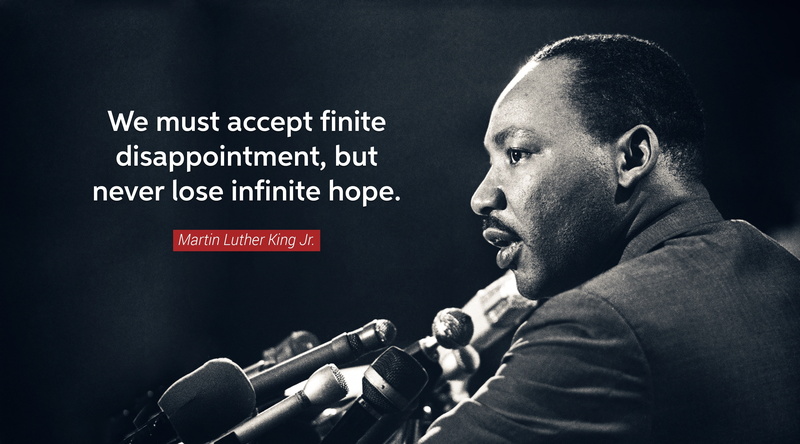 sign, text, black background, men, profile view, camera operator, mlk, martin, people, mid adult, indoors, males, Typography, western script, never, martin luther king jr