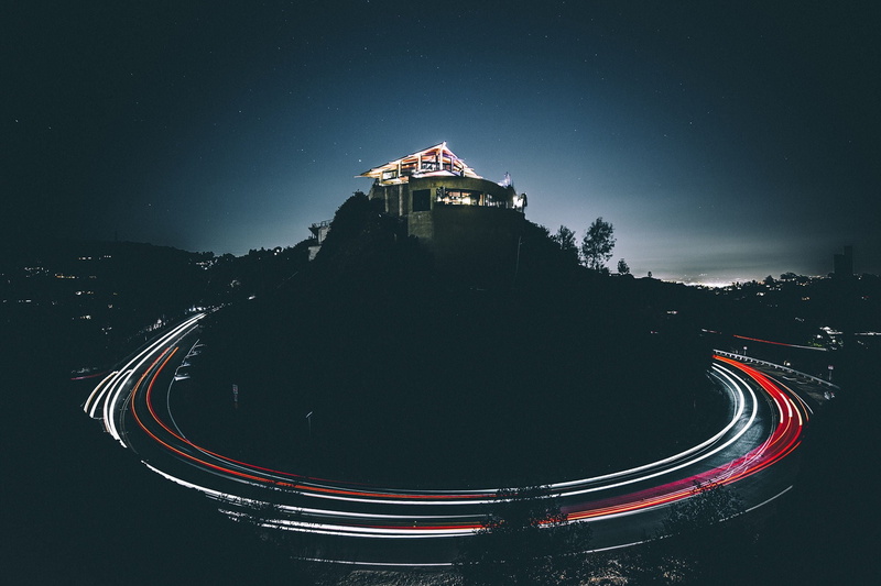 illuminated, hill, transportation, beside, building exterior, architecture, night, building, house, road, nature, symbol, no people, sky, city, history