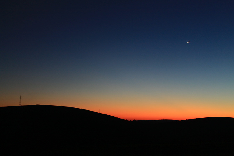 outdoors, dark, sunset, non-urban scene, plateau, clear sky, scenics - nature, solar, sky, crescent, tranquil scene, orange color, idyllic, hills, copy space