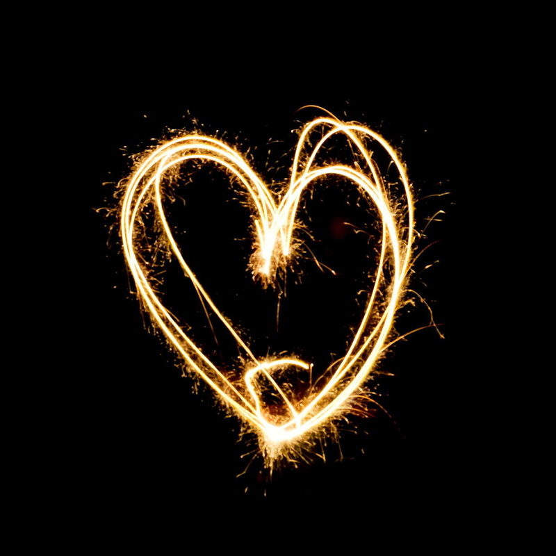 brightly lit, no people, emotion, heart, firework - man made object, light painting, sparks, firework, burning, black background, positive emotion, blurred motion