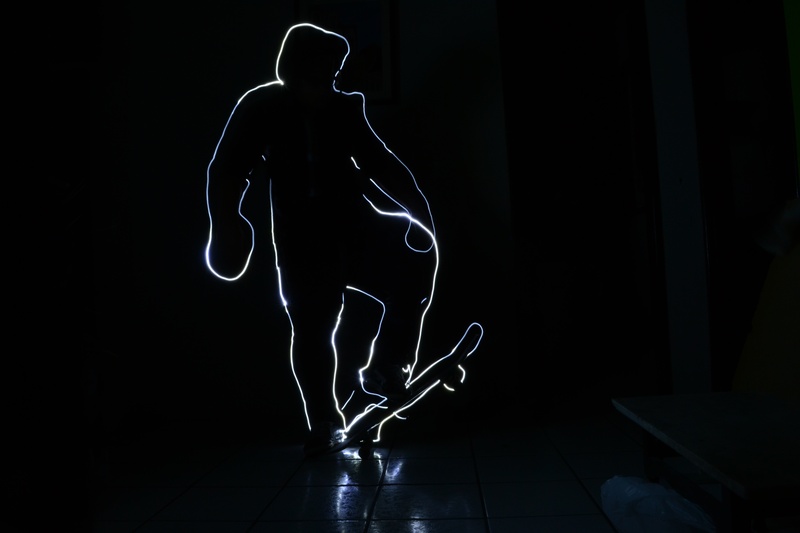 sportsman, illuminated, human representation, motion, standing, back lit, photo, indoors, one person, adult, men, full length, creativity, skateboard, lightpaint