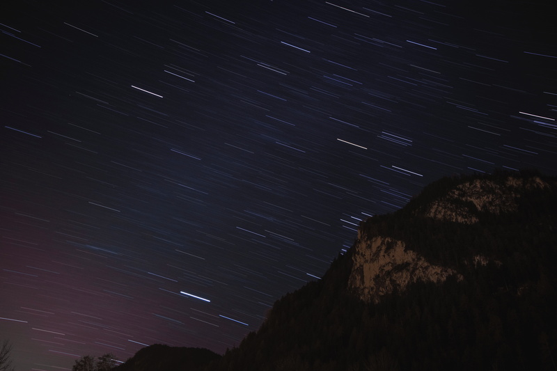 space and astronomy, mountains, infinity, mountain, galaxy, beauty in nature, tranquility, nature, night, star trail, outdoors, forest, scenics - nature