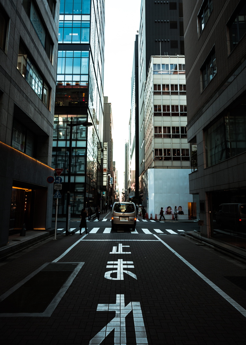 office building exterior, car, sign, street, mode of transportation, marking, road, road marking, nature, 4K, urban, person, wide, incidental people, building