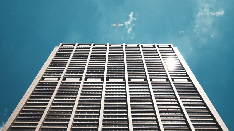 city, air, united states, business, building, low angle view, finance, sky, airline, no people, tall - high, lookup, blue, pollution, plane, modern, skyscraper
