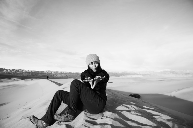 real people, deathvalley, 8K, sky, landscape, cold temperature, outdoors, dessert, looking at camera, sand, one person, park, young adult, leisure activity