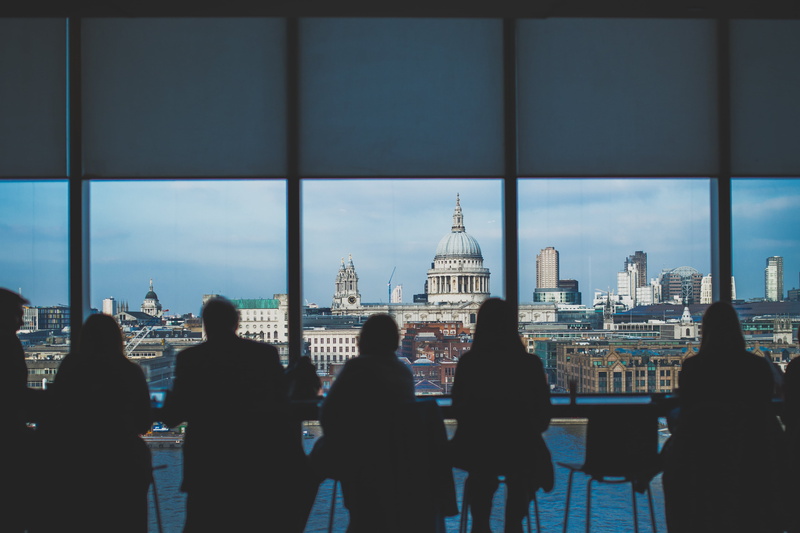 watching, skyscraper, building, restaurant, bar, view, sitting, group of people, thinking, lake, adult, window, sky, modern, men, day, women, silhouette