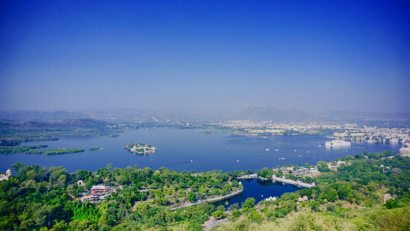 waterfront, sea, travel destinations, islands, building exterior, dark green, body of water, watercrafts, clouds, nature, building, buildings, blue sky