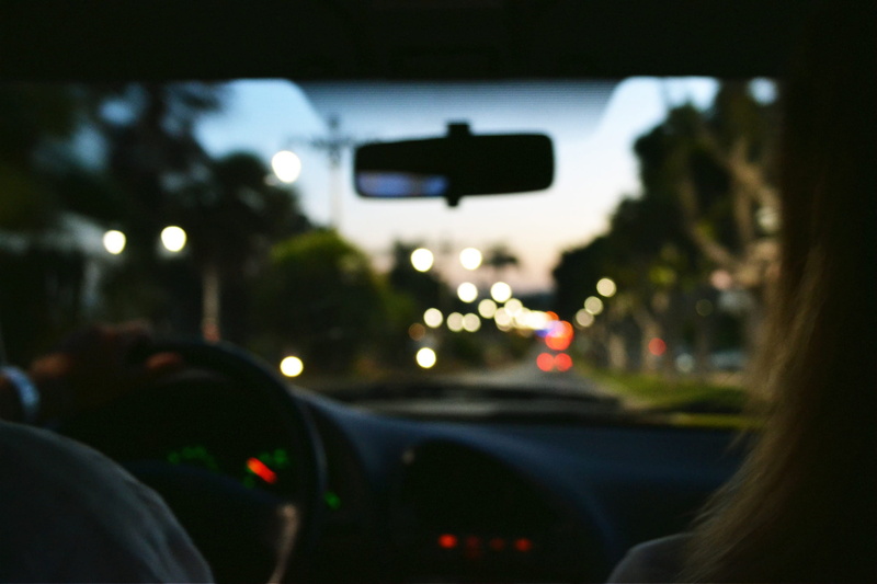 rear-view mirror, street, defocused, mode of transportation, steering wheel, transparent, transportation, people, motor vehicle, various, glass - material