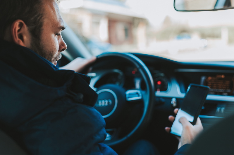 indoors, side view, adult, technology, dashboard, holding, men, smartphone, car interior, road trip, inside, vehicle interior, motor vehicle, black, profile view