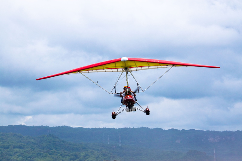 sky, lifestyles, cloud - sky, sport, adventure, special region of yogyakarta, leisure activity, airshow, glider, gliding, flying, indonesia, human arm
