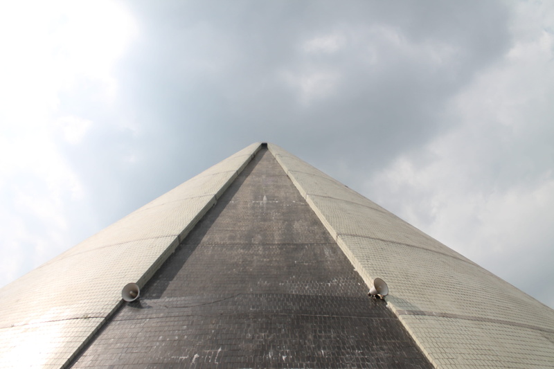 triangle shape, yogyakarta, tower, pyramid, travel destinations, outdoors, building exterior, monument, built structure, day, sky, sunlight, no people