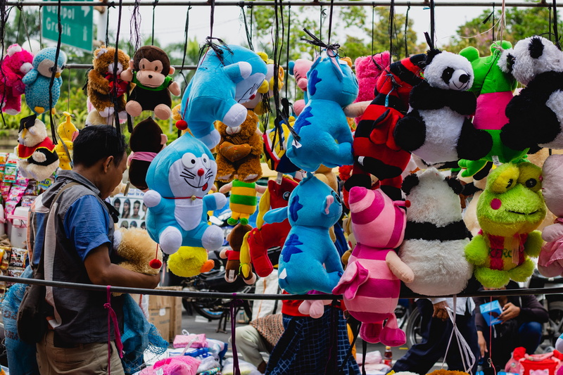 festival, theme park, for sale, creativity, human representation, doll, teddy bear, day, lot, crowd, front, mammal, person, wildlife, variation, art and craft