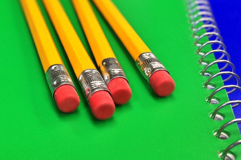 close-up, 2K, green background, no people, student, large group of objects, eraser, art and craft, rubber, study, colored pencil, pencil, table, indoors